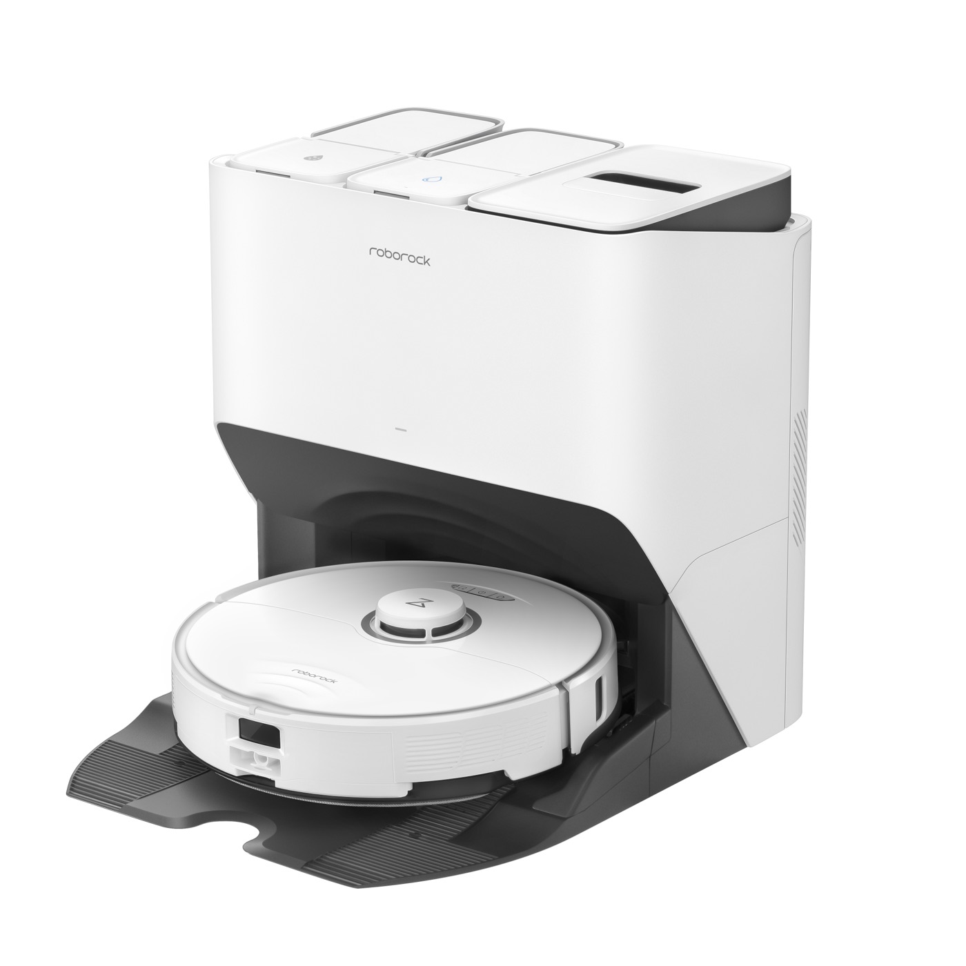White robot vacuum docked in its self-empty base, lids open