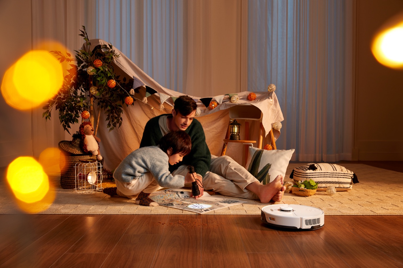 Robot vacuum cleaning a dimly lit living room with people nearby
